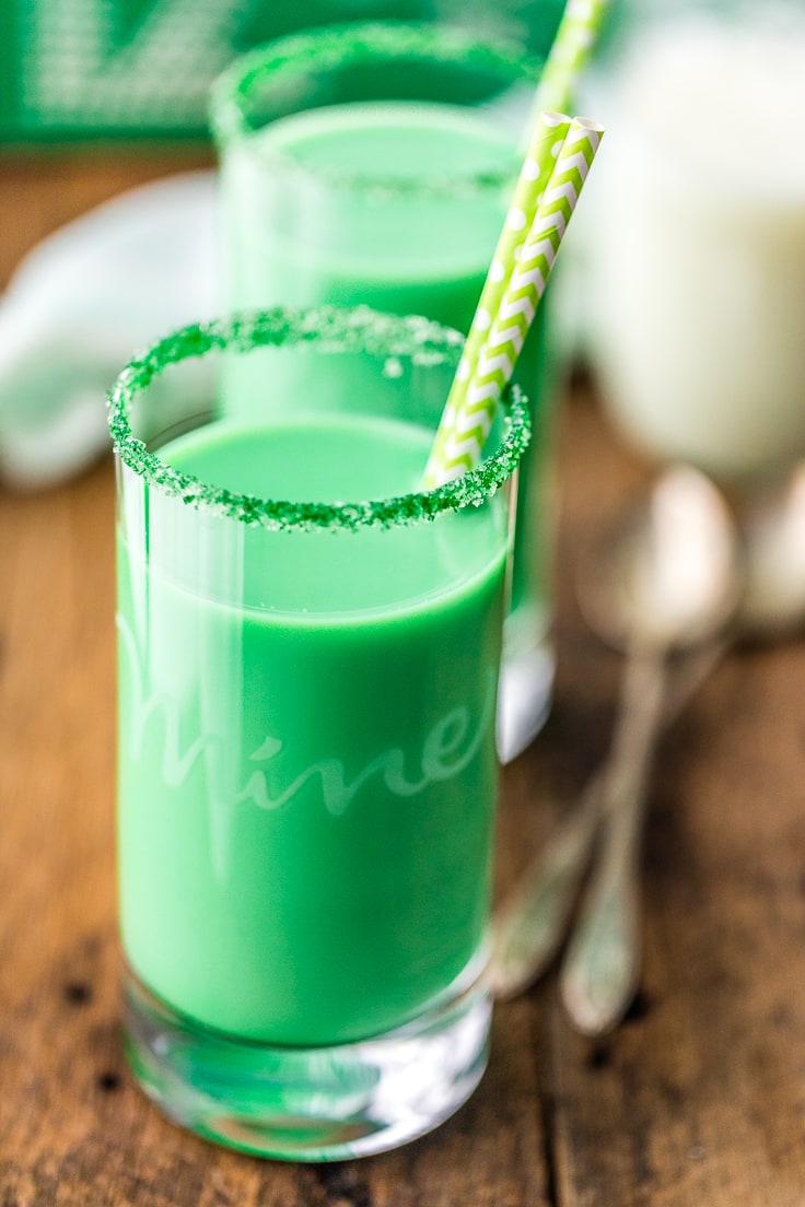 close up on a glass of green milk with green rim