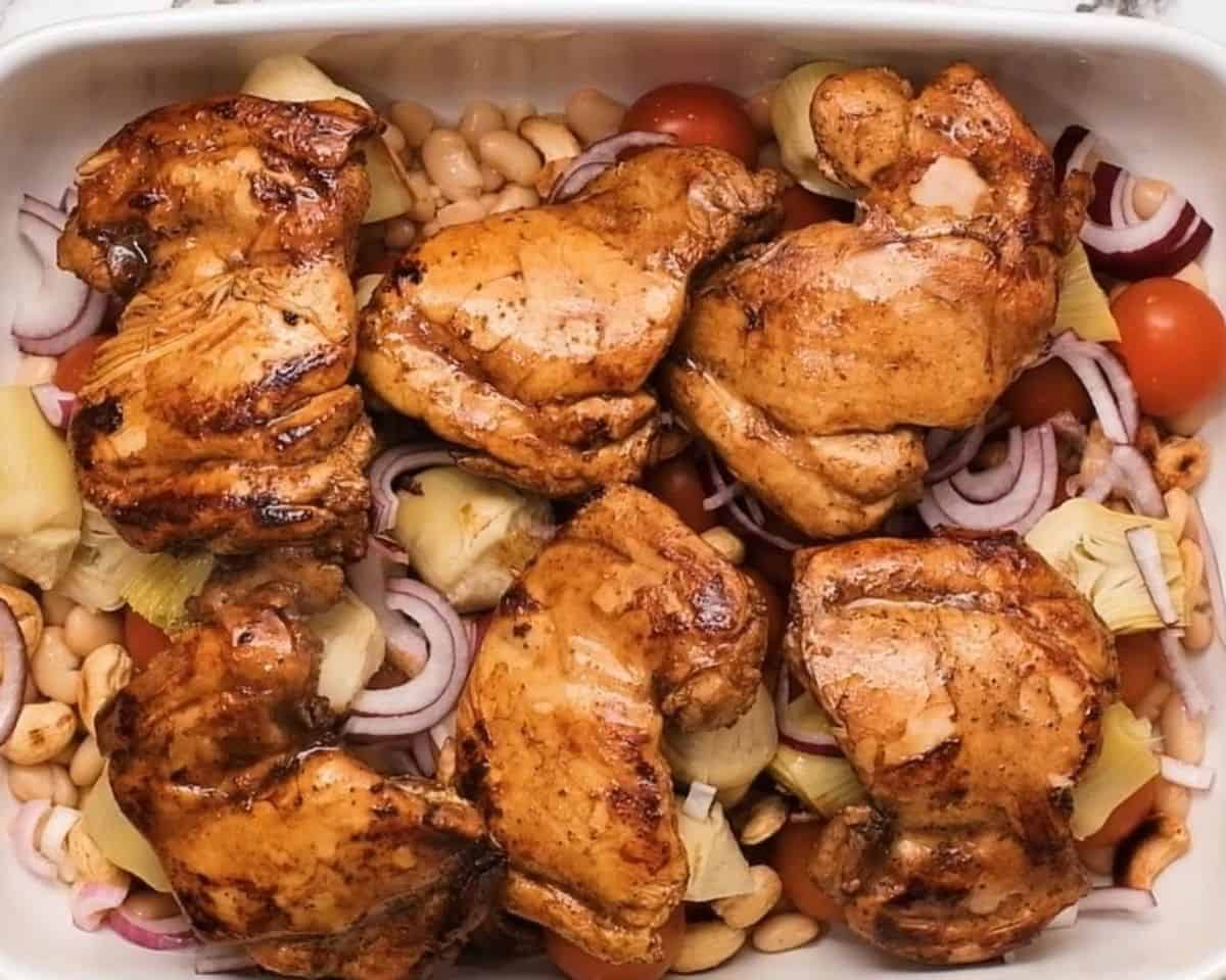 Chicken layered on top of the casserole ingredients.