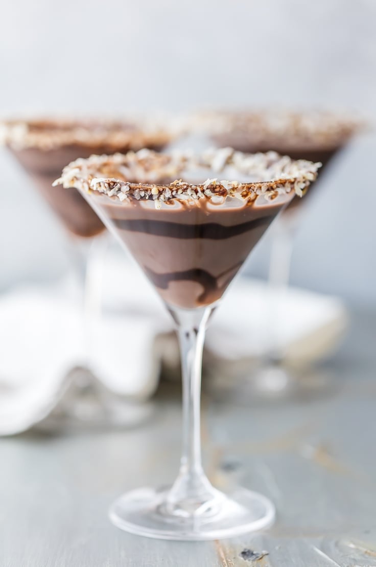 German chocolate cake martini in a glass rimmed with toasted coconut