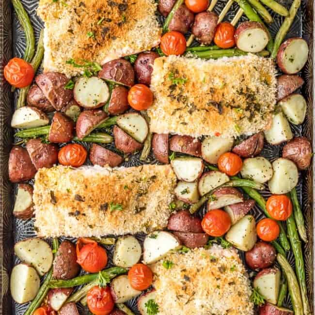 Sheet Pan Honey Mustard Crusted Salmon is the perfect healthy one pan meal! Made in under 30 minutes, skinny, and full of flavor. Oven baked salmon on a baking sheet with potatoes, tomatoes, and green beans!