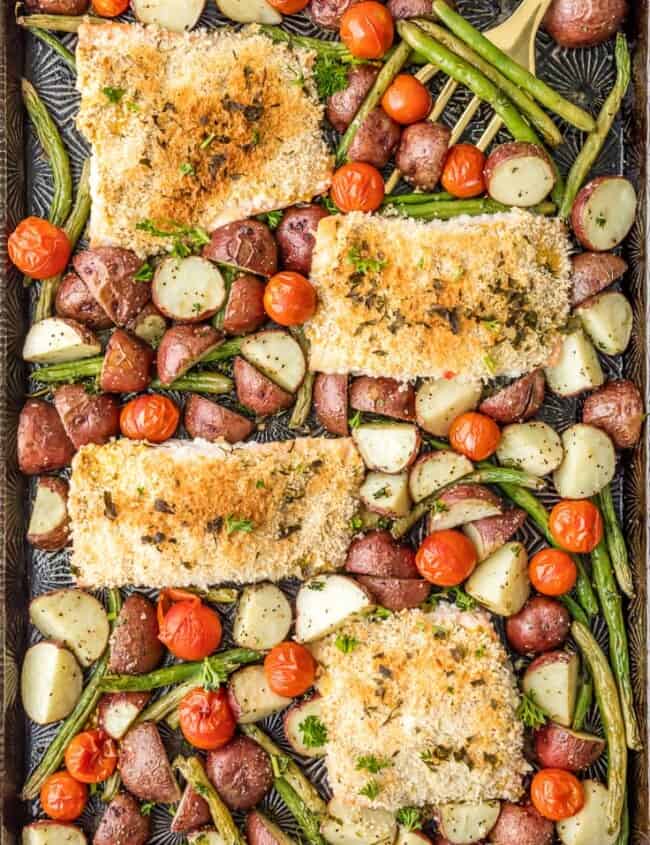 Sheet Pan Honey Mustard Crusted Salmon is the perfect healthy one pan meal! Made in under 30 minutes, skinny, and full of flavor. Oven baked salmon on a baking sheet with potatoes, tomatoes, and green beans!