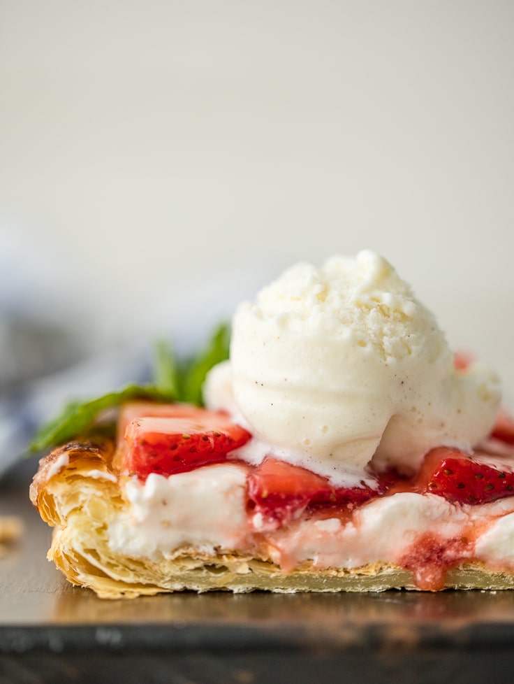 strawberry tart topped with vanilla ice cream