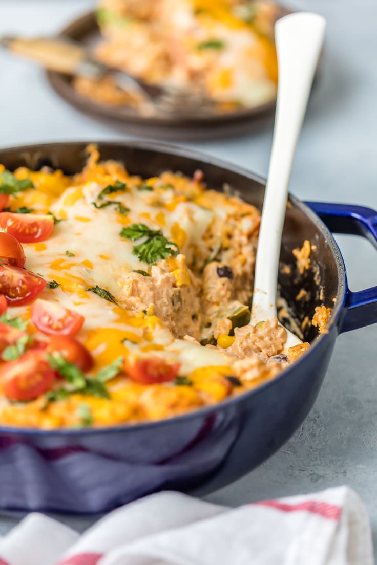 casserole layered with cheese, rice, bell peppers, beans, and more
