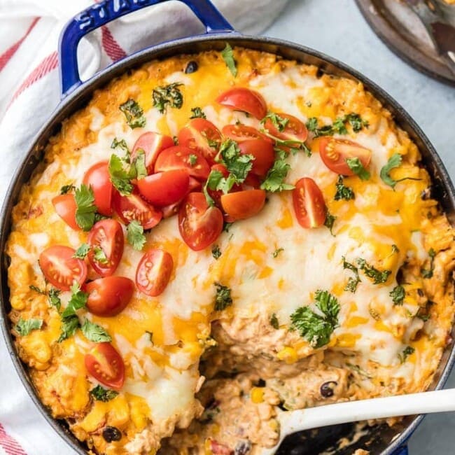 pan of enchilada stuffed pepper casserole and a spoon