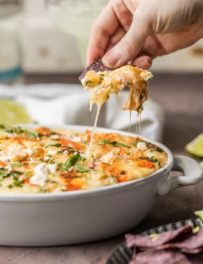 MEXICAN STREET CORN DIP is our favorite Hot Corn Dip! This Mexican Street Corn Recipe is a great way to celebrate Cinco de Mayo! Everything you love about spicy Mexican Dip with a cheesy baked street corn twist . BEST PARTY DIP EVER.