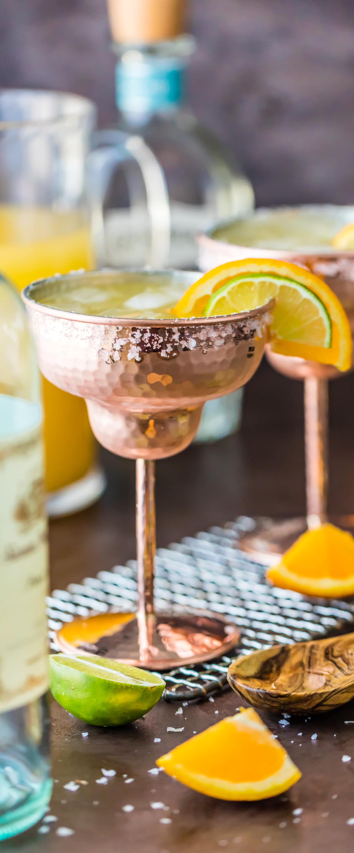 View of finished white wine margarita garnished with an orange and lime