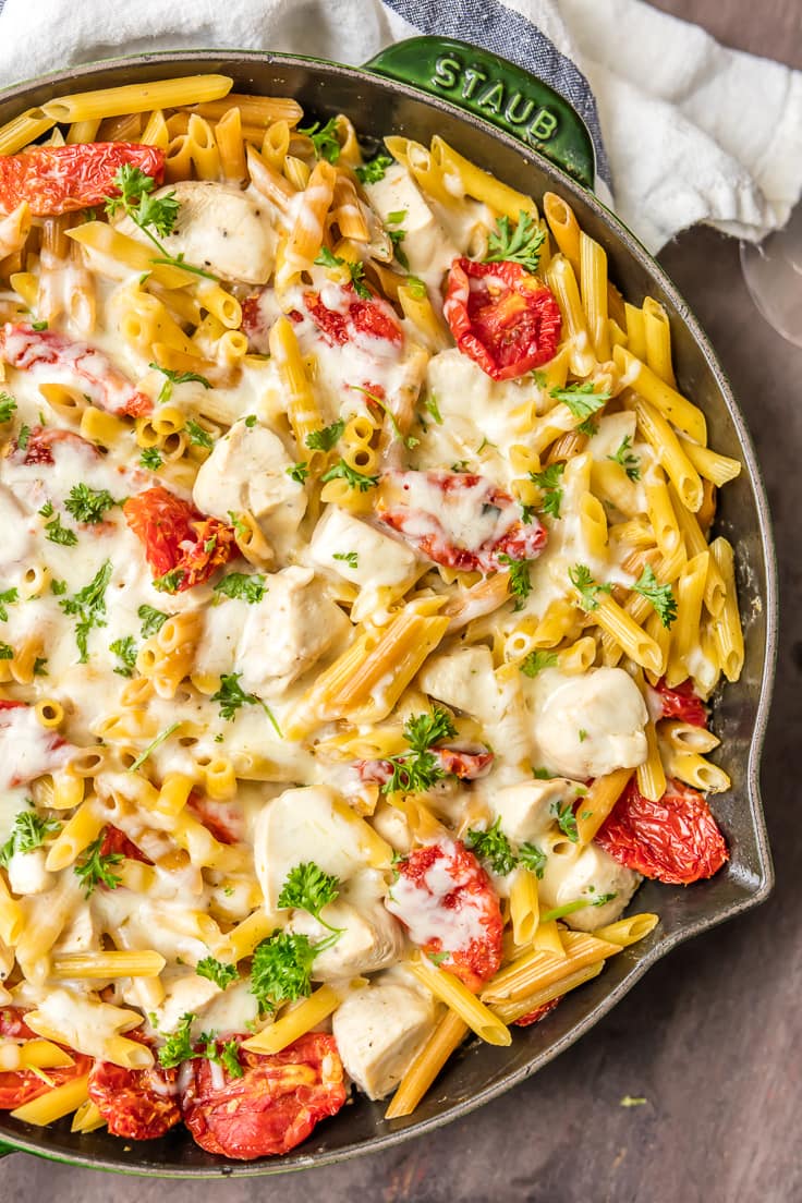 It doesn't get better than ONE POT CHICKEN ALFREDO SKILLET! Creamy one pan Chicken Alfredo made in a skillet tossed with sun dried tomatoes! BEST DINNER EVER.
