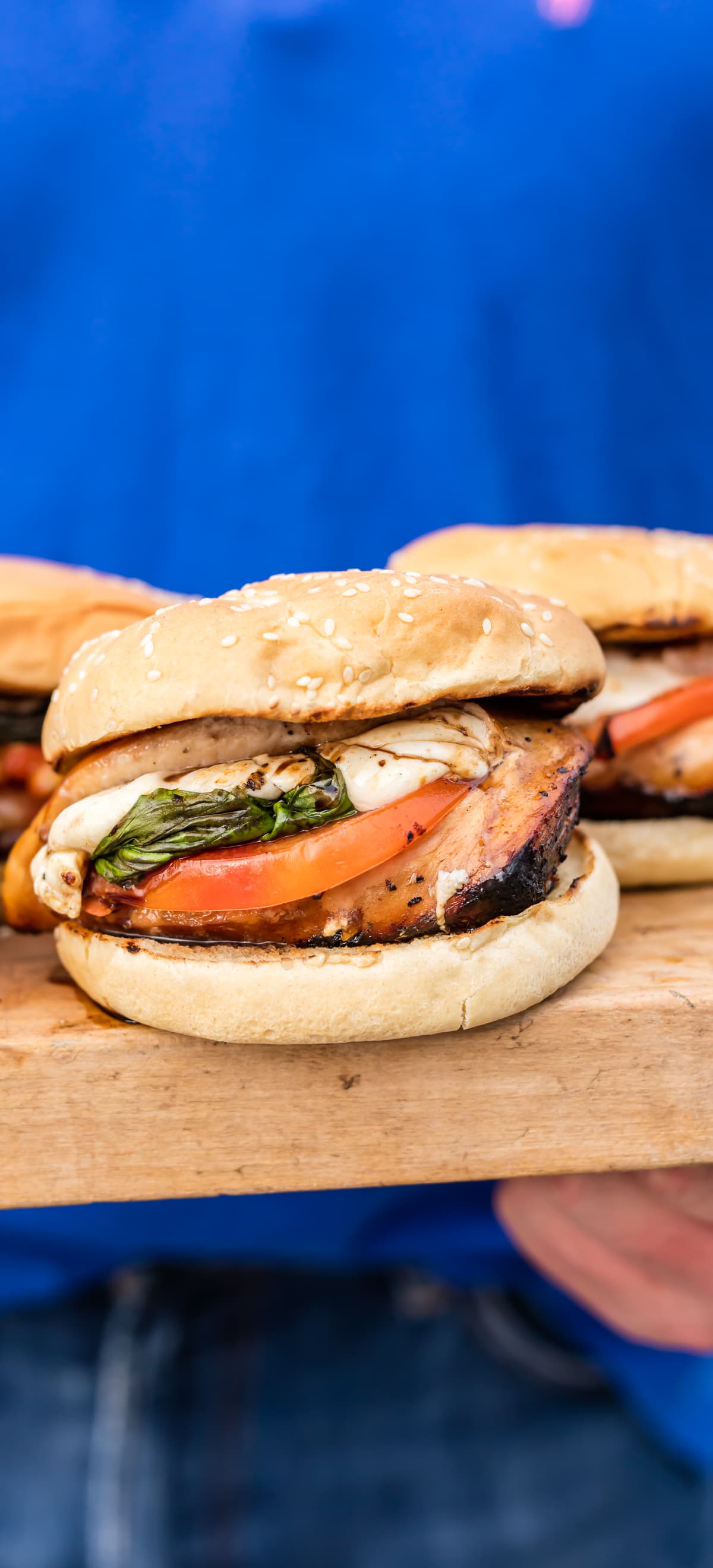 This Stuffed Caprese Chicken Sandwich is our favorite Summer grill recipe! Chicken breasts stuffed with fresh mozzarella, basil, and tomato, marinated in balsamic reduction! AMAZING!