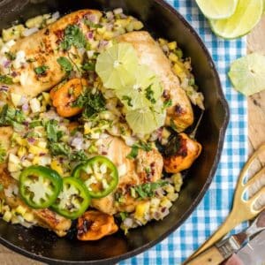 A skillet one One Pan Caribbean Jerk Chicken with Mango Salsa.