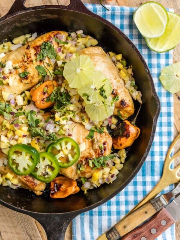 A skillet one One Pan Caribbean Jerk Chicken with Mango Salsa.