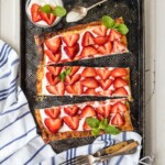 sliced strawberry tart on plate
