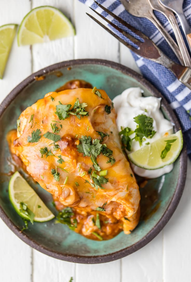 This ONE PAN ENCHILADA STUFFED CHICKEN SKILLET (Or Inside Out Chicken Enchiladas) are a family favorite! Chicken stuffed with rice, enchilada sauce, cream cheese, tomatoes, and more cheese! You've never had a meal this good!