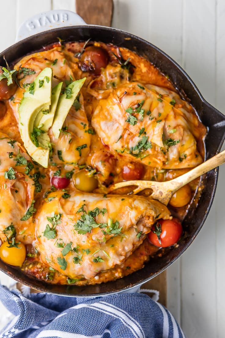 chicken breast covered in cheese in a skillet