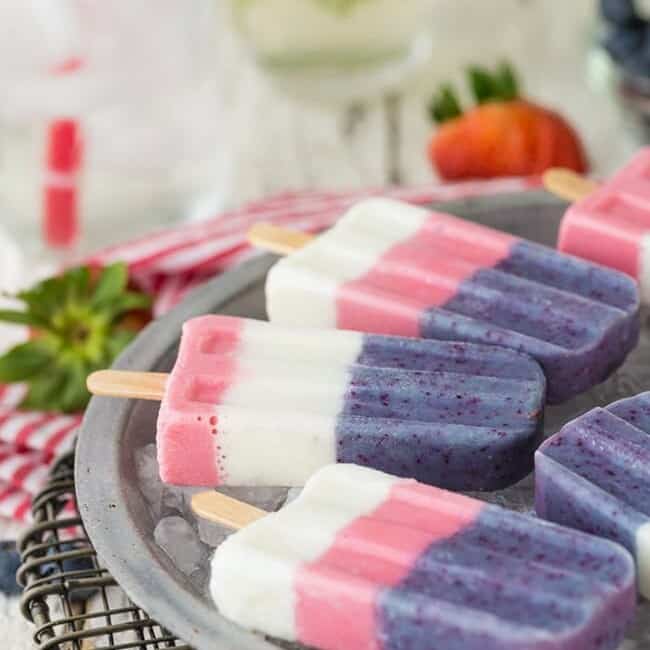 Red, White, and Blue Smoothie Pops on a table