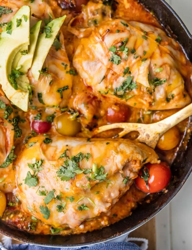 This ONE PAN ENCHILADA STUFFED CHICKEN SKILLET (Or Inside Out Chicken Enchiladas) are a family favorite! Chicken stuffed with rice, enchilada sauce, cream cheese, tomatoes, and more cheese! You've never had a meal this good!