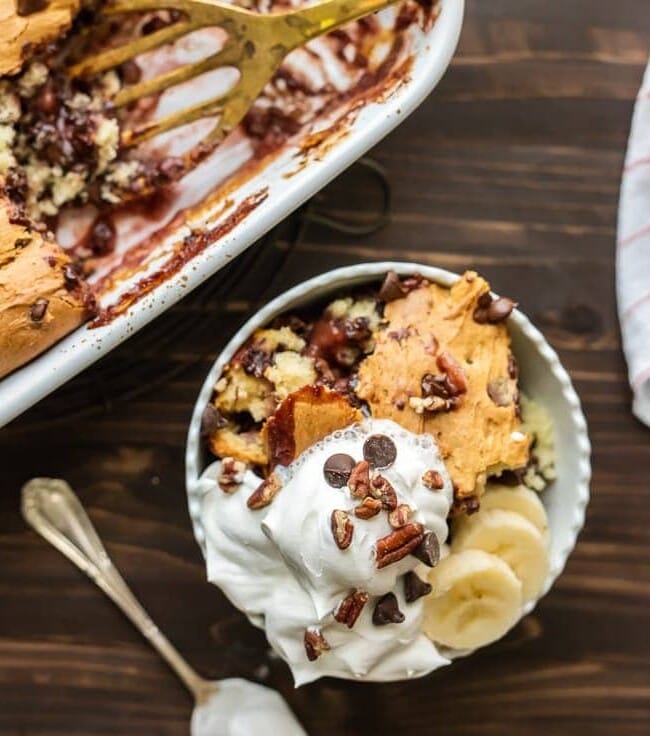 Banana Split Dump Cake is the BEST DESSERT EVER!! This dump cake is thrown together in minutes with just 6 ingredients and is sure to be an instant crowd pleaser!