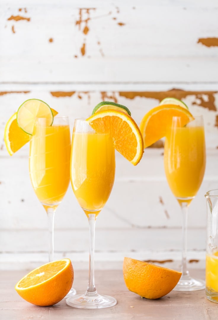 three glasses of mimosas
