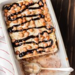 snickers ice cream cake in a dish with spoon