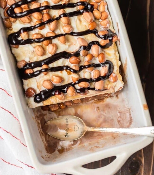 Be the hero of any party with this LAZY GIRL'S SNICKERS ICE CREAM CAKE! Made with pound cake, chocolate and vanilla ice cream, caramel, and peanuts. BEST EASY ICE CREAM CAKE EVER!
