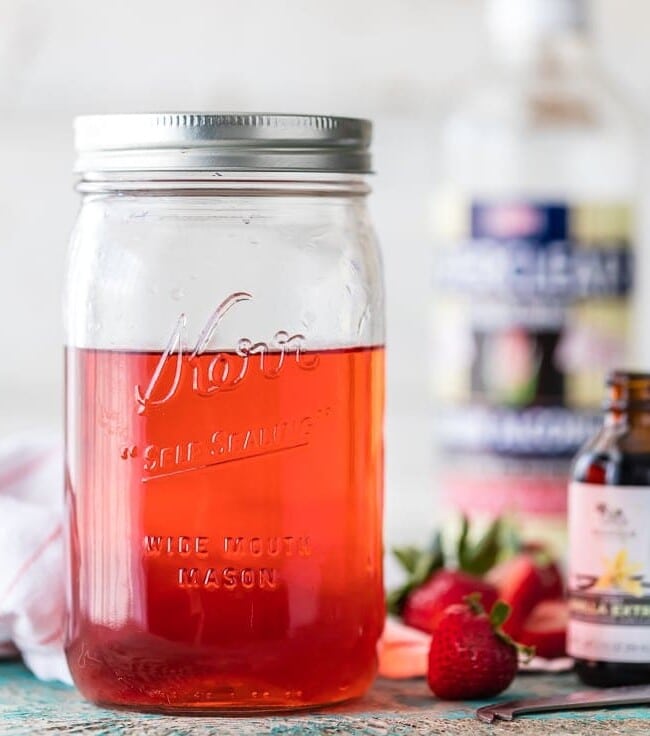 You can make HOMEMADE STRAWBERRY SHORTCAKE VODKA at home! SO easy and tastes amazing! Perfect with SPIKED STRAWBERRY SHORTCAKE ICE CREAM FLOATS! The ultimate Summer treat.