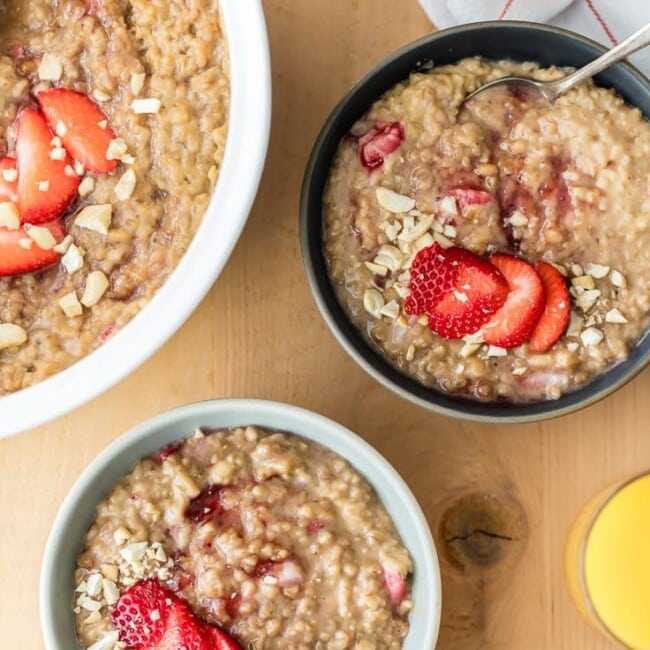 three bowls of oatmeal on a table