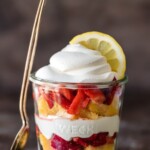 layered lemon strawberry shortcake cup with a spoon