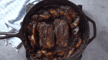 Bbq ribs in a cast iron skillet with apple butter.