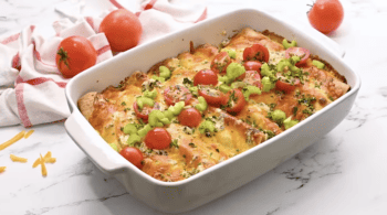 A casserole dish filled with buffalo chicken and cheese.