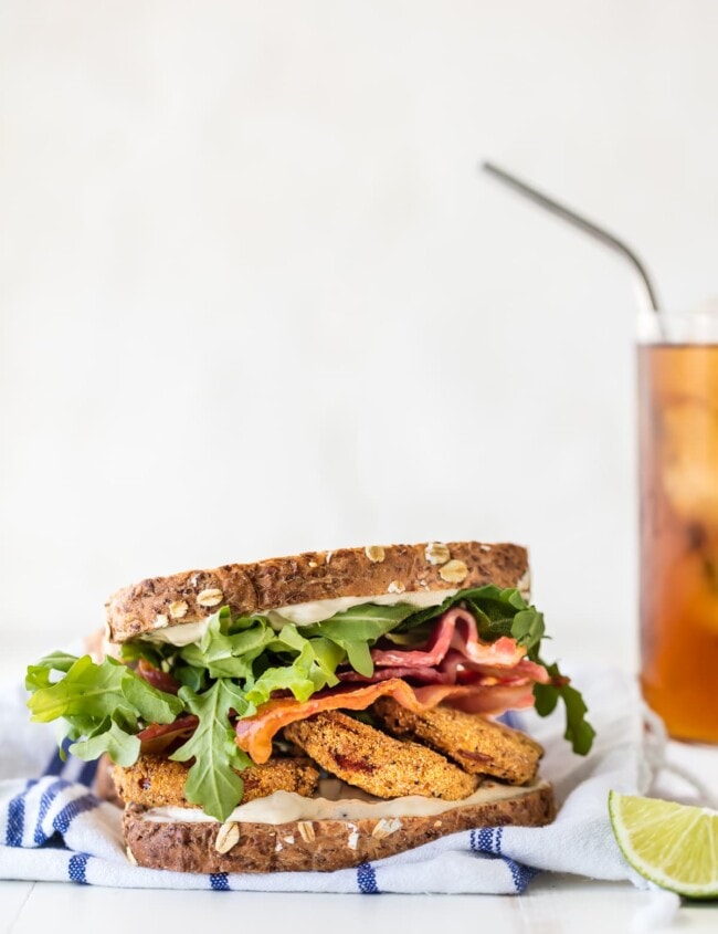 This BLT recipe with Fried Tomatoes and Cilantro Lime Mayo is the best sandwiches ever! Re-imagine this classic sandwich recipe and make it a family favorite. Loaded with herbed fried tomatoes, cilantro lime mayo, arugula, and BACON! 