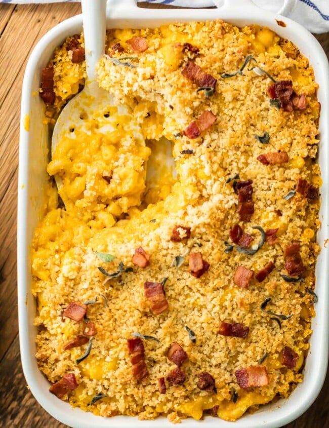 Baked Pumpkin Bacon Mac and Cheese is the ULTIMATE comfort food for Fall! Autumn in a casserole dish! Loaded with cheese, bacon, pumpkin, sage, and more cheese. BEST MACARONI AND CHEESE EVER!