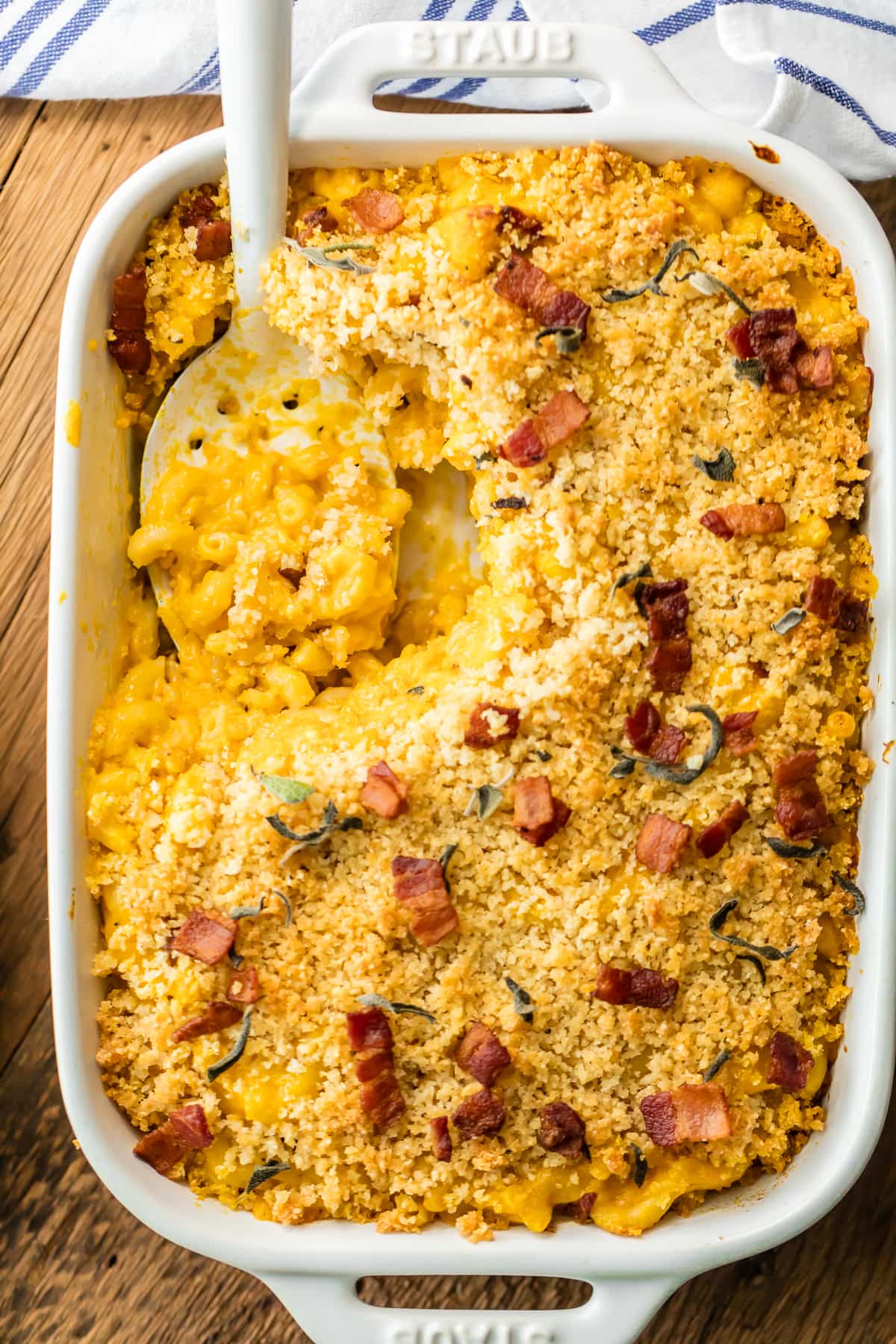 Pumpkin Mac and Cheese in a casserole dish, topped with bacon