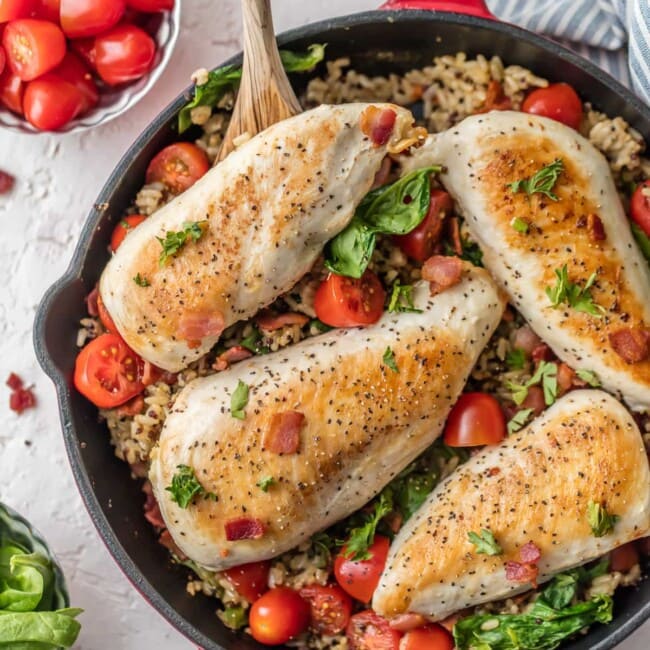 This BLT Chicken and Rice Skillet is the perfect one pan meal to feed the whole family! It's loaded with garlic, chicken, bacon, tomatoes, spinach, and a brown rice & quinoa mix! This chicken and rice recipe is totally delicious and SO EASY!