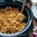 This Slow Cooker Velveeta Broccoli Rice Casserole is our go-to holiday side dish. Using a Crockpot is such an easy way to make cheesy broccoli and rice casserole. This Thanksgiving and Christmas favorite is easier than ever when made in a slow cooker!