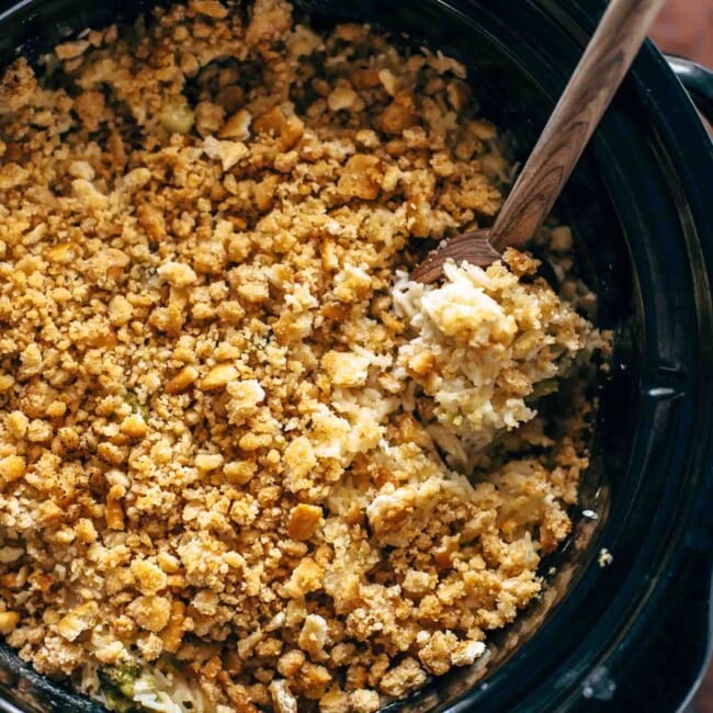 A crock pot full of granola with a wooden spoon, but replace "granola" with "velveeta" and "wooden spoon" with "broccoli rice casserole.