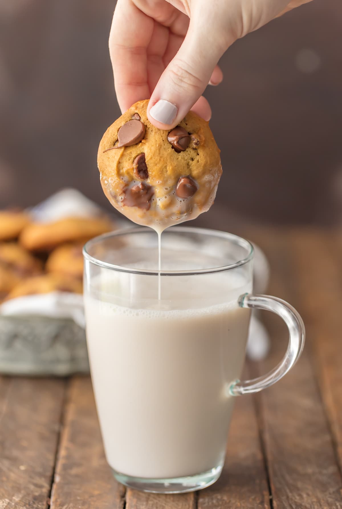 Dipping a chocolate chip cookie in a glass of milk