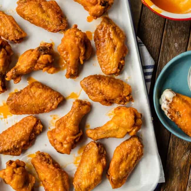 The BEST FRIED BUFFALO WINGS that just so happen to be GLUTEN FREE! Spicy deep fried buffalo chicken wings perfect for tailgating, the Super Bowl, and every day in between!