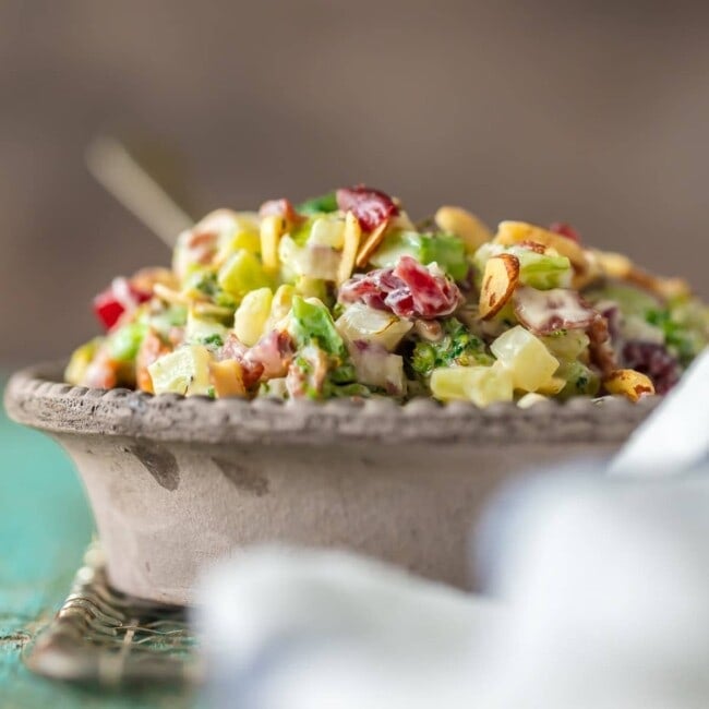 This Broccoli Salad recipe is a twist on a holiday classic! Almond Broccoli Cranberry Salad has so much flavor because it's filled with best ingredients. This delicious charred broccoli salad with bacon is sure to be your favorite Thanksgiving or Christmas side dish!