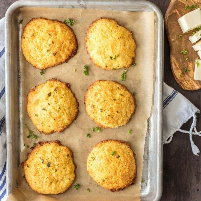 cheesy garlic cornbread drop biscuits on a cooking pan