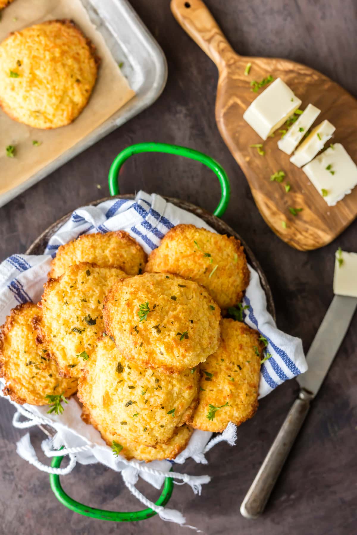 A basket filled with garlic cheese cornbread biscuits