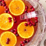 EASY HOLIDAY PUNCH perfect for Thanksgiving and Christmas! Cranberry Juice, Orange Juice, Ginger Ale, and more! Alcoholic or nonalcoholic versions!! Perfect party punch cocktail for a crowd!