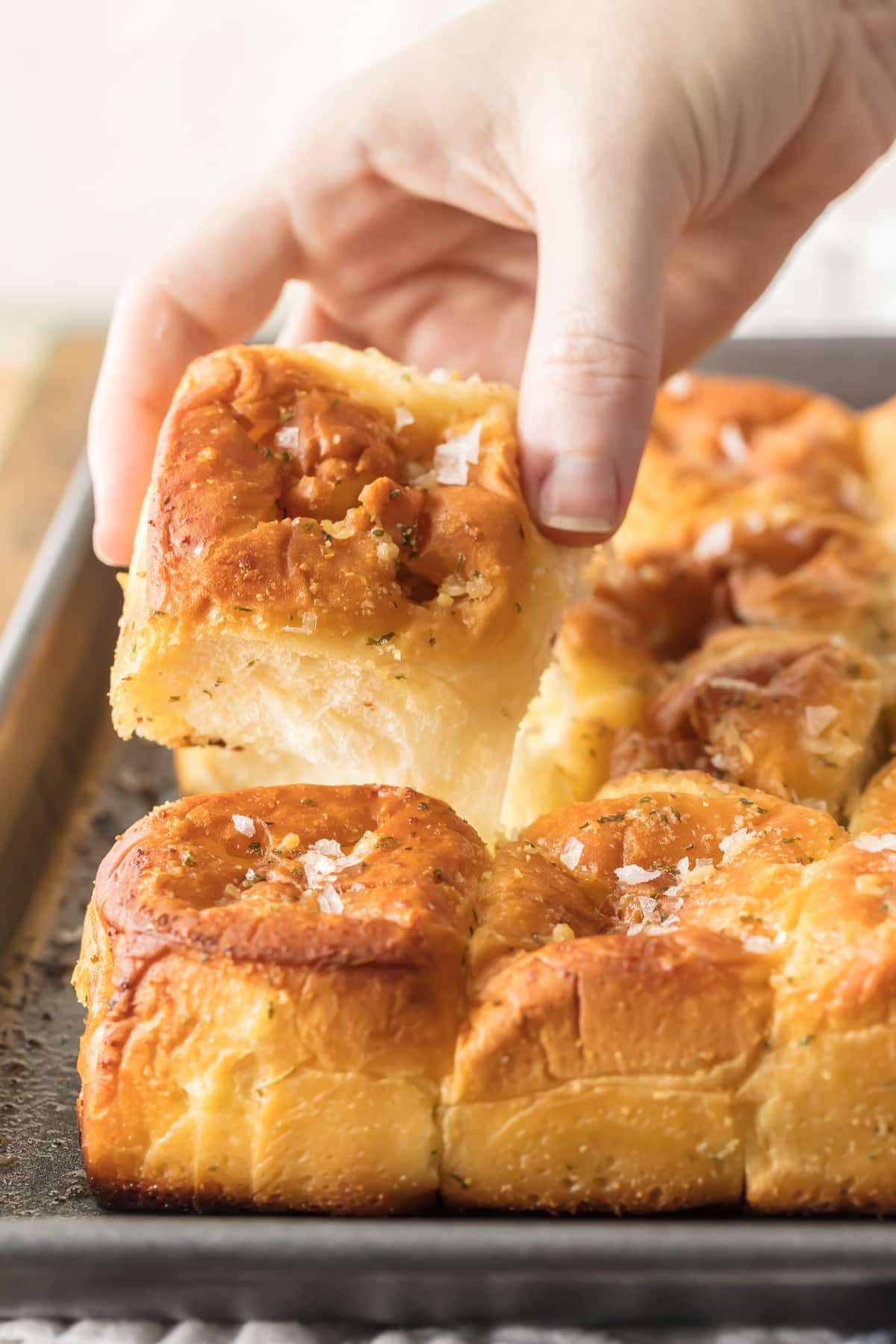 These EASY Garlic Butter Hawaiian Rolls are literally the best rolls I have EVER TASTED! Made in just minutes and SO easy, the perfect bread side for Thanksgiving, Christmas, or any holiday!