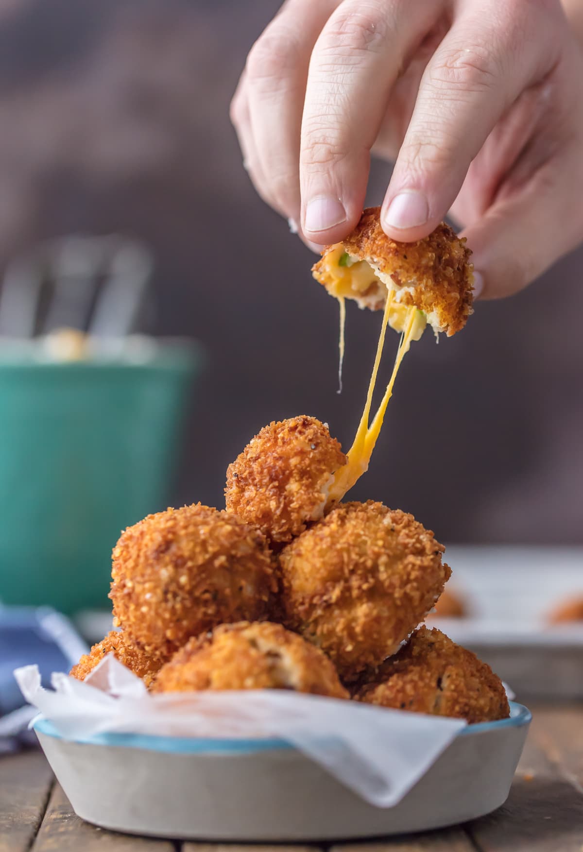 DEEP FRIED LOADED MASHED POTATO BITES loaded with bacon, cheese, and onions are perfect for Thanksgiving leftovers! Put those leftover mashed potatoes to good use and fry them! The ultimate appetizer or side dish!