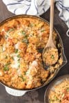 SKILLET CHICKEN CON QUESO is the ultimate one pot meal! Cheesy rice loaded with cilantro, pico de gallo, green chiles, and cream topped with taco spiced chicken. Comfort food has never been easier or cheesier!