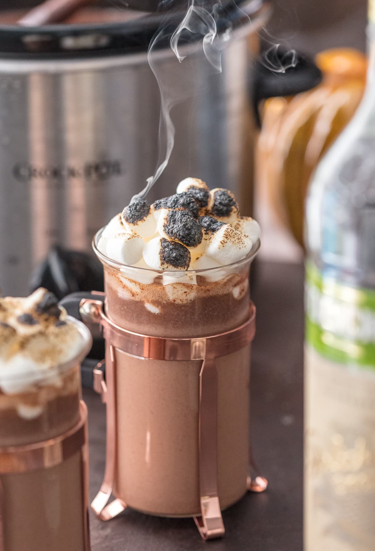 Pumpkin Spice Slow Cooker Hot Chocolate topped with toasted marshmallows