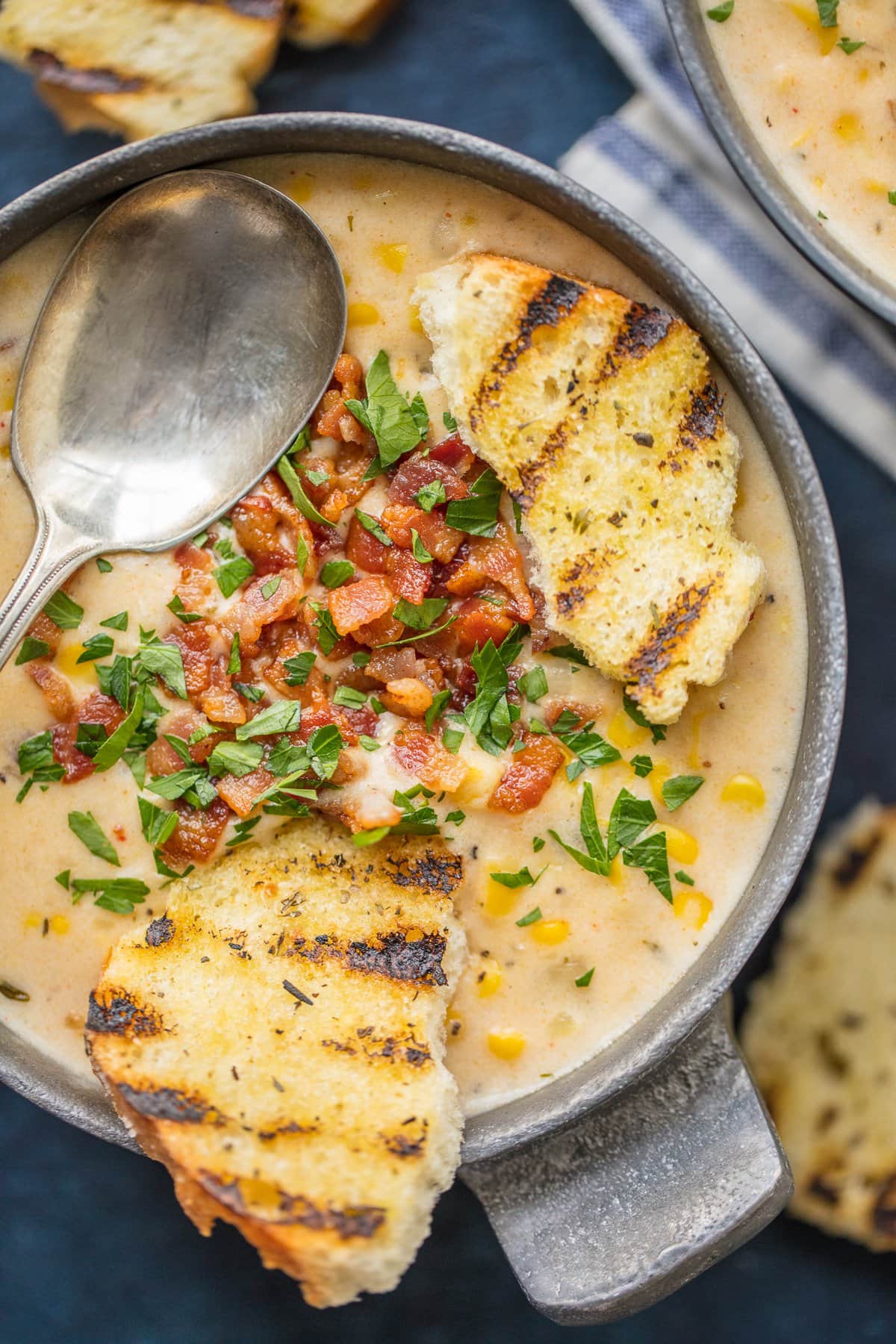 A bowl of corn chowder with bacon