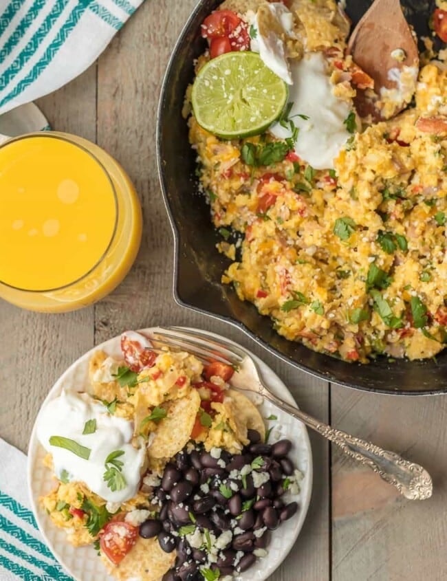 CHEESY MIGAS are a family favorite breakfast recipe for Christmas morning! This Tex-Mex migas recipe is made up of scrambled eggs, lots of cheese, veggies, tortilla chips, and so much more. It's an easy skillet breakfast the entire family will love!