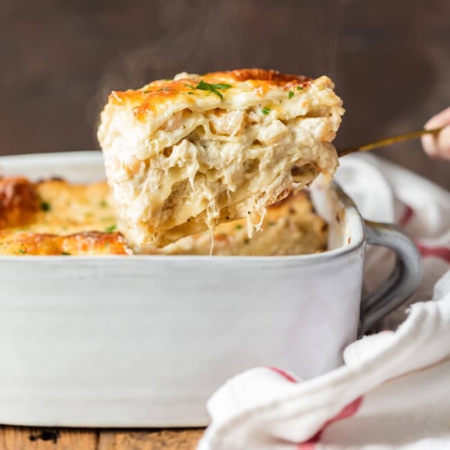 seafood lasagna coming out of baking dish