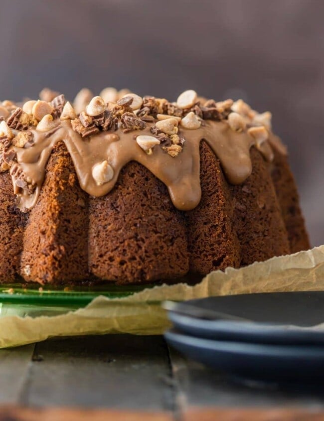CHOCOLATE PEANUT BUTTER CUP POUND CAKE is the ultimate bundt cake recipe! Topped with a decadent peanut butter icing, this indulgent cake is perfect for the holidays!