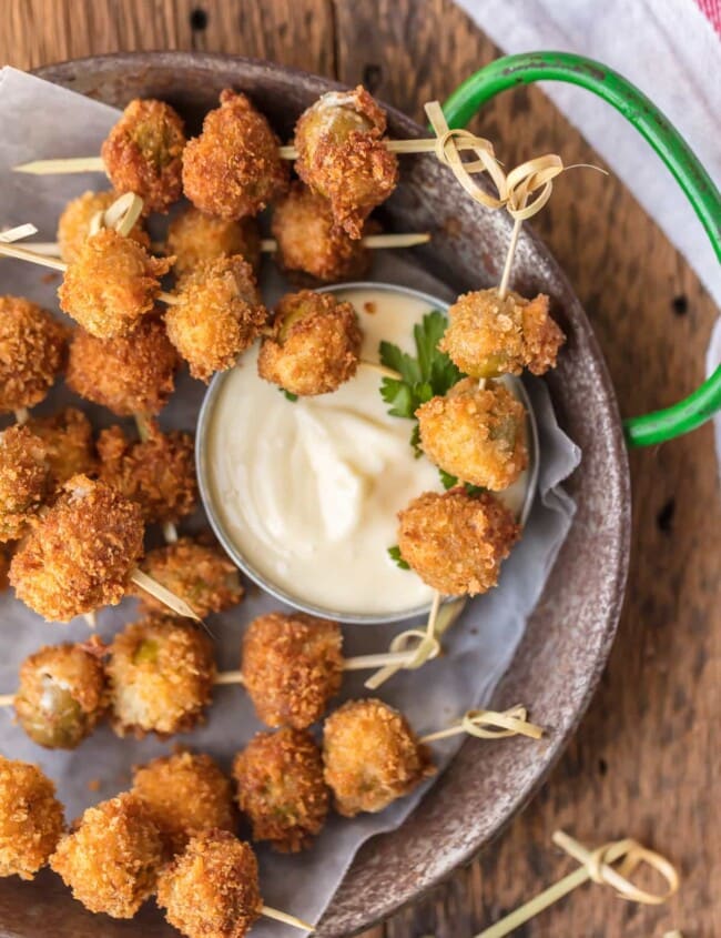 These FRIED BLUE CHEESE STUFFED OLIVES are just delicious. And when served with a simple garlic aioli sauce, they are absolutely addicting! These fried and stuffed olives are the perfect holiday appetizer, just what you need for Christmas or New Year's Eve!
