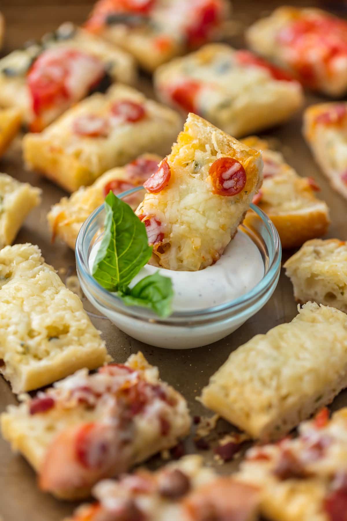 French Bread Pizza Bites, with one in the middle dipped in ranch